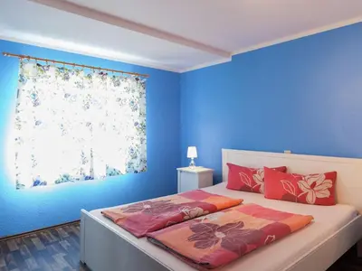 Ein Bett oder Betten in einem Zimmer der Unterkunft Gemütliches Ferienhaus in Sebnitz