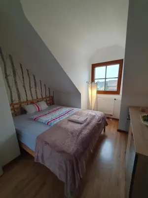 Ein Bett oder Betten in einem Zimmer der Unterkunft Gästewohnung Elbblick - Reinkommen, Wohlfühlen und den Ausblick genießen