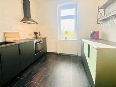 Küche/Küchenzeile in der Unterkunft Komfortable Ferienwohnung im Stadtzentrum und Seenähe