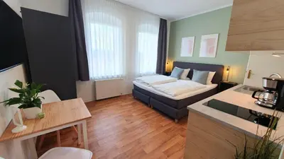 Ein Bett oder Betten in einem Zimmer der Unterkunft Good Stay Aparthotel mit kostenlosen Parkplätzen