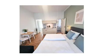 Ein Bett oder Betten in einem Zimmer der Unterkunft Good Stay Aparthotel mit kostenlosen Parkplätzen