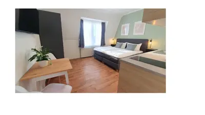 Ein Bett oder Betten in einem Zimmer der Unterkunft Good Stay Aparthotel mit kostenlosen Parkplätzen