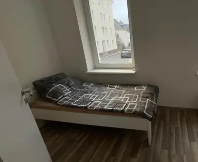Ein Bett oder Betten in einem Zimmer der Unterkunft Buildingz Apartments Freiberg