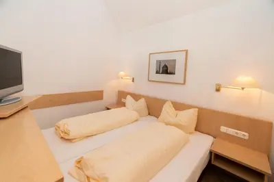 Ein Bett oder Betten in einem Zimmer der Unterkunft Pension HOFZWANZIG Dresden-Laubegast