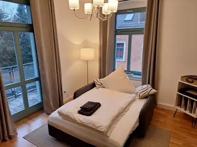 Ein Bett oder Betten in einem Zimmer der Unterkunft Schick übernachten im historischen Viertel