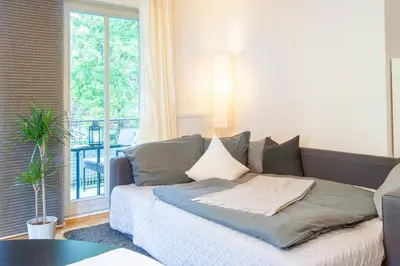 Ein Bett oder Betten in einem Zimmer der Unterkunft Wohnglück mit Balkon im Preußischen Viertel