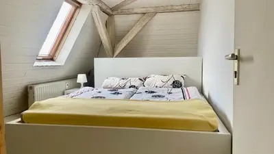 Ein Bett oder Betten in einem Zimmer der Unterkunft Dresden City - über den Dächern der Stadt