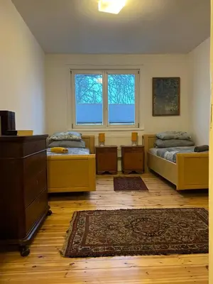 Ein Bett oder Betten in einem Zimmer der Unterkunft Rim Ferienwohnung in Lauchhammer 1 OG 100 qm