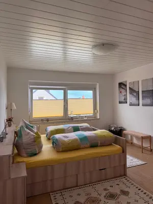 Ein Bett oder Betten in einem Zimmer der Unterkunft Einfamilienhaus unterm Dach