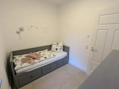 Ein Bett oder Betten in einem Zimmer der Unterkunft Ferienwohnung 