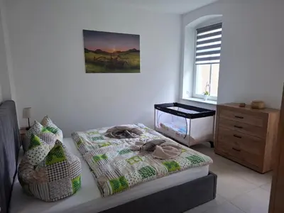 Ein Bett oder Betten in einem Zimmer der Unterkunft Ferienwohnung 