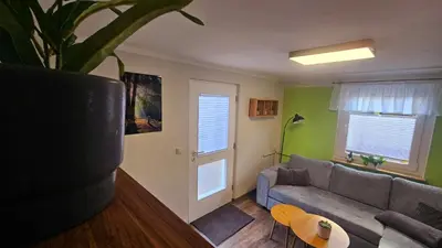 Ein Sitzbereich in der Unterkunft Ferienwohnung Lindenbaum