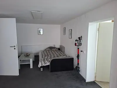 Ein Bett oder Betten in einem Zimmer der Unterkunft Ferienwohnung Waldblick mit Sauna