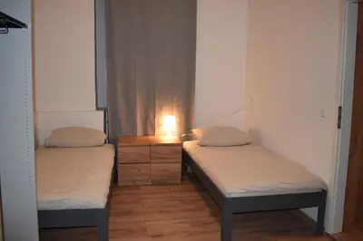 Ein Bett oder Betten in einem Zimmer der Unterkunft Hotel New Town