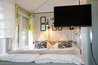 Ein Bett oder Betten in einem Zimmer der Unterkunft Ferienhaus Tinylausitz mit Kamin und Sauna