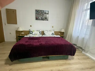 Ein Bett oder Betten in einem Zimmer der Unterkunft Landgasthof zur guten Quelle