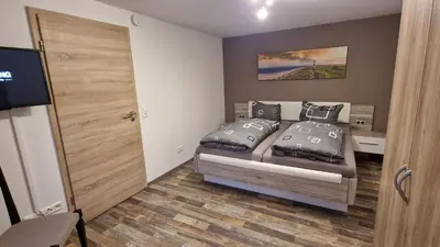 Ein Bett oder Betten in einem Zimmer der Unterkunft Ferienwohnung Rinno