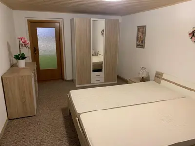 Ein Bett oder Betten in einem Zimmer der Unterkunft Ferienwohnung Peter Müller