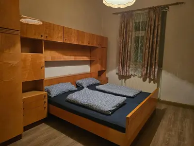 Ein Bett oder Betten in einem Zimmer der Unterkunft Unterkunft für Familien, Montagen arbeiter, und und und, Sweet Home