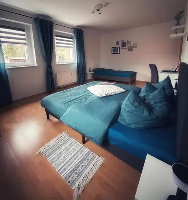 Ein Bett oder Betten in einem Zimmer der Unterkunft Quartier 3punkt0 alte Steigerbaude
