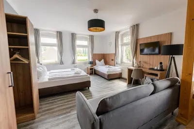 Ein Bett oder Betten in einem Zimmer der Unterkunft ElbApartments - Sächsische Schweiz - Ferienwohnungen zum Malerweg - Bastei Urlaub