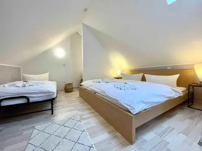 Ein Bett oder Betten in einem Zimmer der Unterkunft Villa Monsei - das Herzstück in Bad Schandau, top Lage, modern, mit Parkplatz!