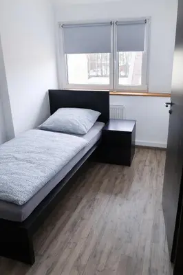 Ein Bett oder Betten in einem Zimmer der Unterkunft Monteurwohnungen in Chemnitz