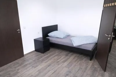 Ein Bett oder Betten in einem Zimmer der Unterkunft Monteurwohnungen in Chemnitz