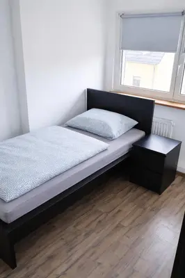 Ein Bett oder Betten in einem Zimmer der Unterkunft Monteurwohnungen in Chemnitz