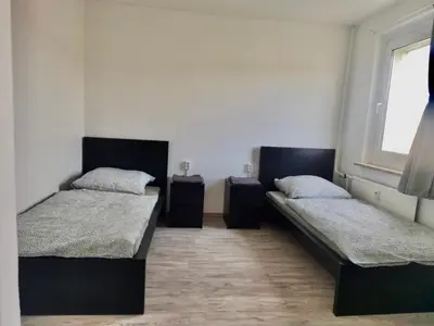 Ein Bett oder Betten in einem Zimmer der Unterkunft 4 Bett Monteurwohnung in Zeithain