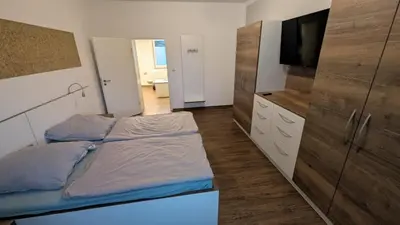 Ein Bett oder Betten in einem Zimmer der Unterkunft Ferienwohnung Alexander