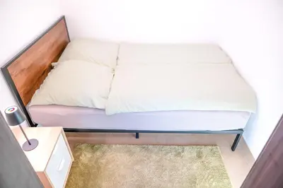 Ein Bett oder Betten in einem Zimmer der Unterkunft Wohnung in Loschwitz mit Parkplatz