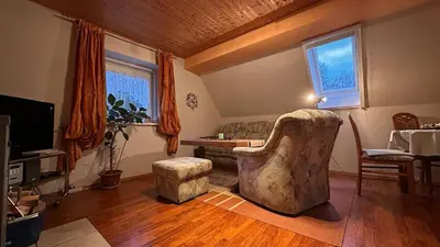 Ein Sitzbereich in der Unterkunft Ferienwohnung Altes Forsthaus Sächsische Schweiz