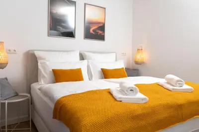 Ein Bett oder Betten in einem Zimmer der Unterkunft Ferienwohnung Bastei mit Stellplatz im Zentrum