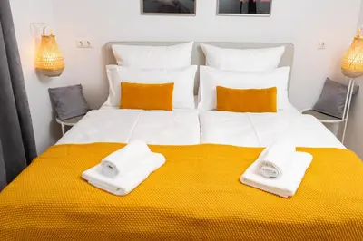 Ein Bett oder Betten in einem Zimmer der Unterkunft Ferienwohnung Bastei mit Stellplatz im Zentrum