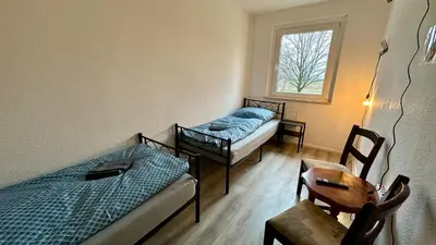 Ein Bett oder Betten in einem Zimmer der Unterkunft MiCasa TuCasa - 3-R Apartment Leipziger Neuseenland Mira