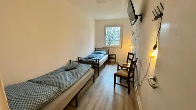 Ein Bett oder Betten in einem Zimmer der Unterkunft MiCasa TuCasa - 3-R Apartment Leipziger Neuseenland Mira