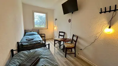 Ein Bett oder Betten in einem Zimmer der Unterkunft MiCasa TuCasa - 3-R Apartment Leipziger Neuseenland Mira