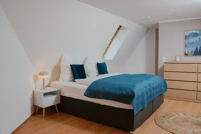 Ein Bett oder Betten in einem Zimmer der Unterkunft JINO Königstein l Elbblick - WLAN - stilvoll