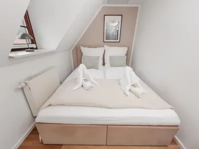 Ein Bett oder Betten in einem Zimmer der Unterkunft JINO Königstein l Elbblick - WLAN - stilvoll