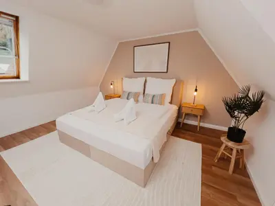 Ein Bett oder Betten in einem Zimmer der Unterkunft JINO Königstein l Elbblick - WLAN - stilvoll