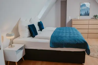 Ein Bett oder Betten in einem Zimmer der Unterkunft JINO Königstein l Elbblick - WLAN - stilvoll