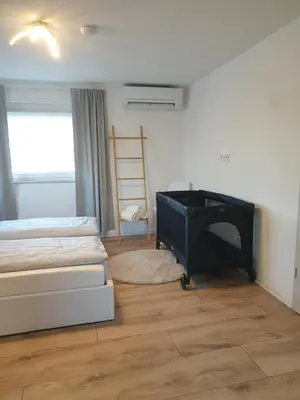 Ein Bett oder Betten in einem Zimmer der Unterkunft NEU! Ferienhaus am Sonnenlandpark - Haus Anja
