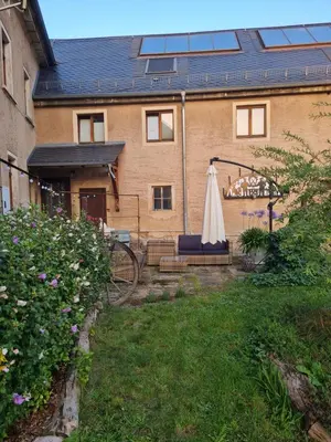 Ein Garten an der Unterkunft Porschendorfer Mühle