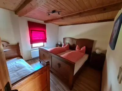 Ein Bett oder Betten in einem Zimmer der Unterkunft Porschendorfer Mühle