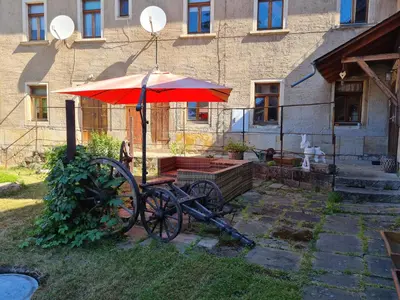 Ein Garten an der Unterkunft Porschendorfer Mühle