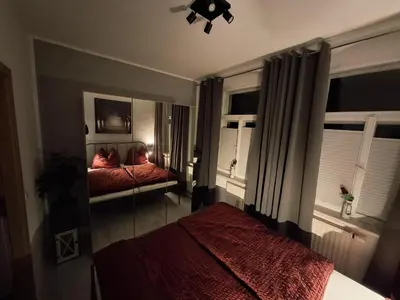 Ein Bett oder Betten in einem Zimmer der Unterkunft Ferienwohnung im Zschopauer Herzen