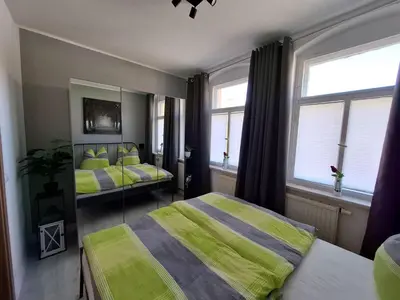 Ein Bett oder Betten in einem Zimmer der Unterkunft Ferienwohnung im Zschopauer Herzen