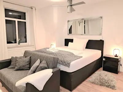 Ein Bett oder Betten in einem Zimmer der Unterkunft Enjoy Dresden Appartement