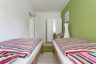Ein Bett oder Betten in einem Zimmer der Unterkunft Ferienwohnung am Bienertpark